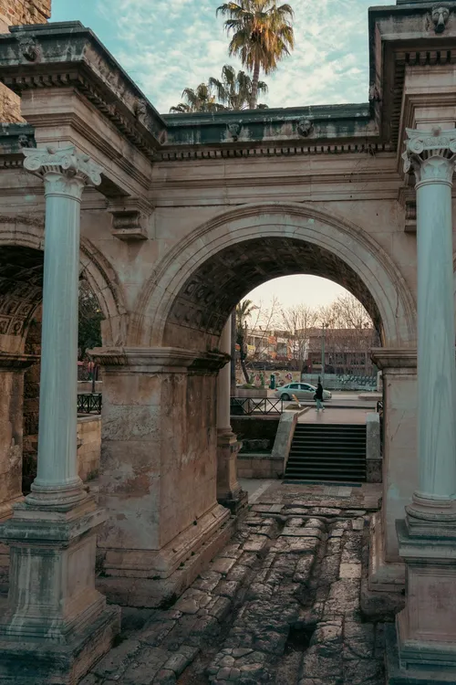 Hadrian's Gate, a Roman triumphal arch in Antalya old city — one of Turkey's best-preserved ancient landmarks, minutes from Taki Dent clinic