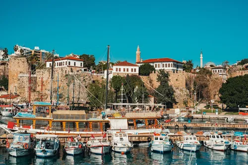 Antalya's historic harbour lined with boats — a picturesque Mediterranean setting that makes dental tourism in Turkey a genuinely enjoyable experience